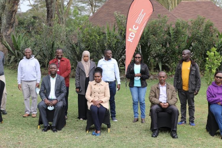  A section of staff alongside the independent consultant pose for a group photo during a previous session on QMS